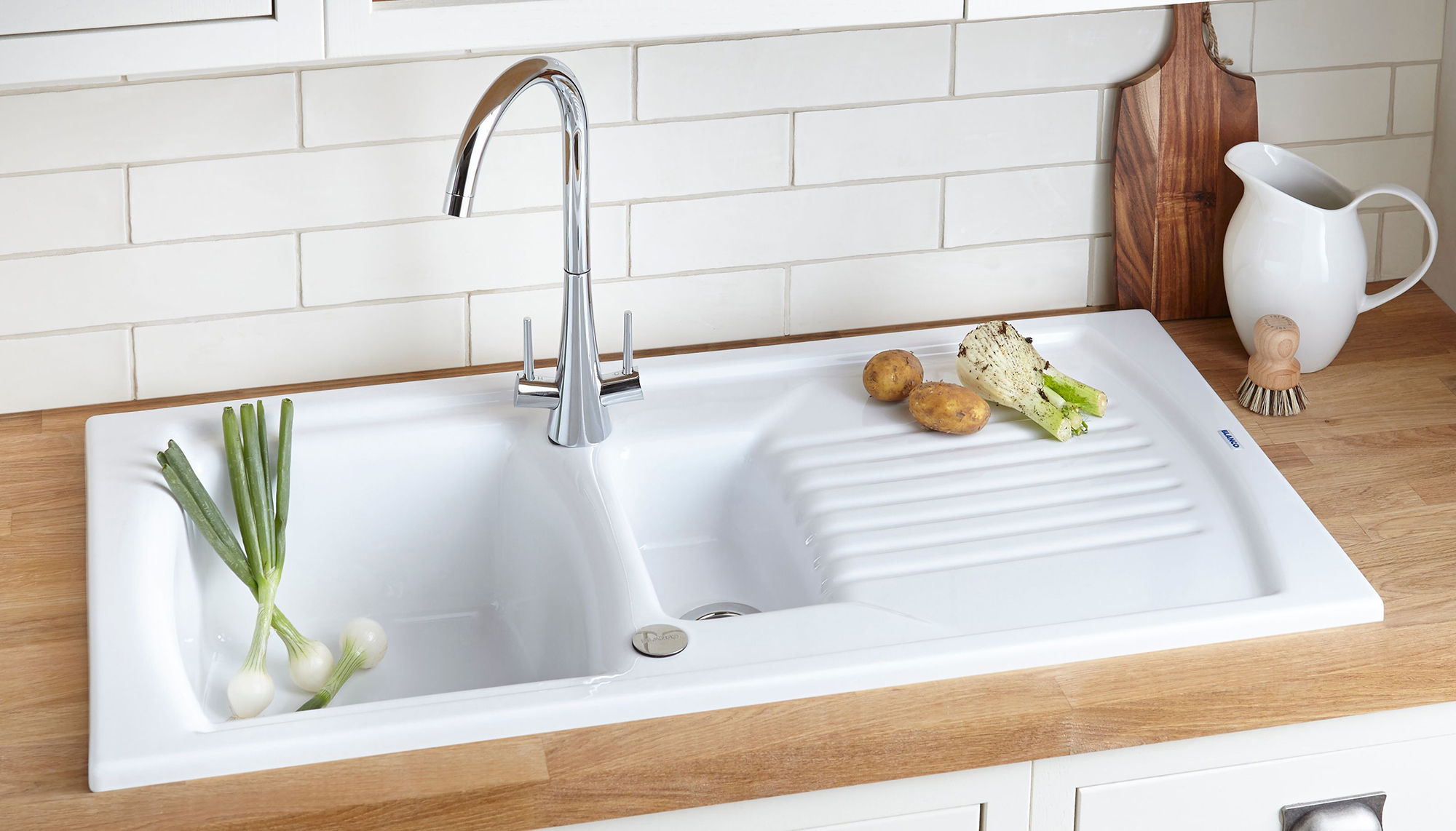 white kitchen sink taps